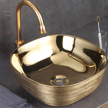 Европейские керамические раковины для ванной комнаты, раковина для столешницы, раковина для домашнего мытья, Дизайнерская Креативная Золотая раковина для ванной комнаты с одной раковиной